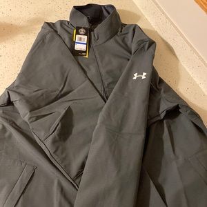 Under Armor wind breaker like jacket in grey with a white UA symbol.